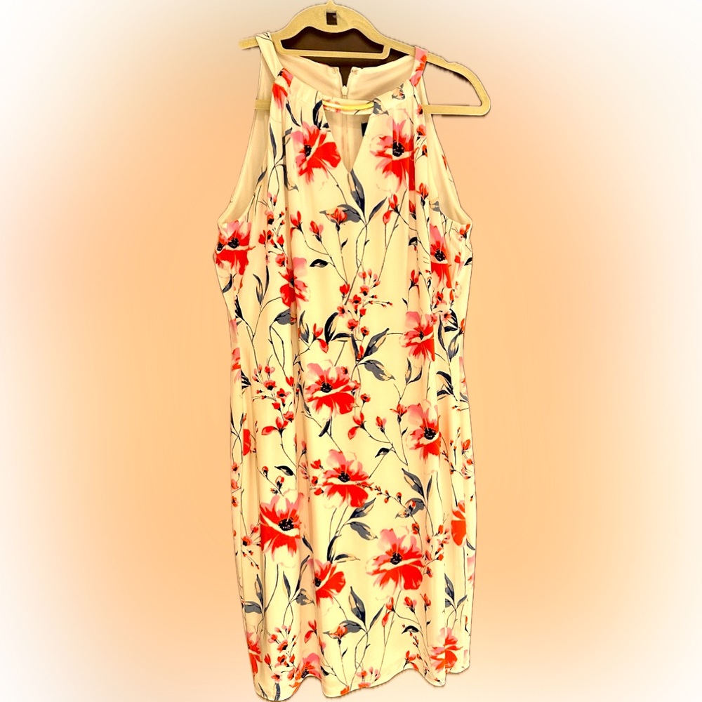 Lined dressy dress. No sleeve. Gold neckl line.Floral print